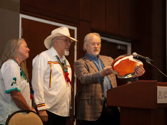 Dan Derksen presents a Nambe platter to Dr. Carlos Gonzales.