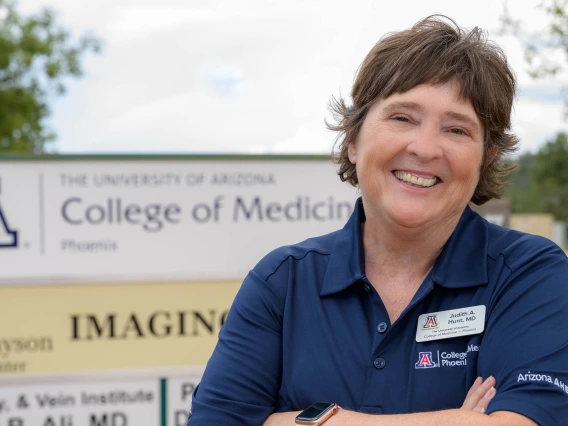 Judith Hunt, MD, shown standing in front of University College of Medicine Phoenix 