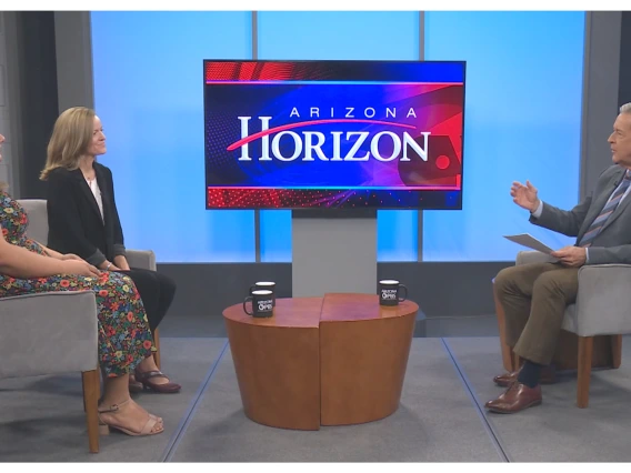 two women sit for a tv interview