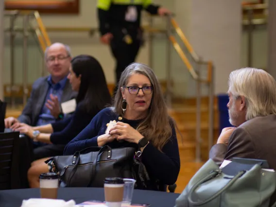 Representative Longdon listens to Dr. Derksen