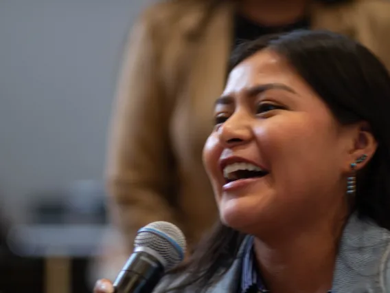 an attendee asks a question of a presenter