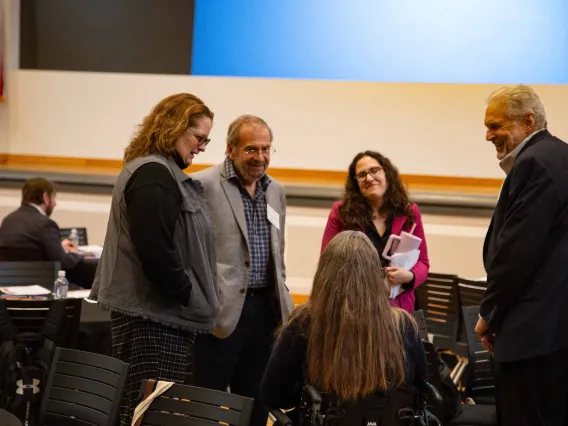 a small group of people in discussion