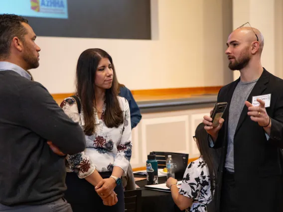 Marcus Johnson, Carmen Heredia listen to Alex Demyan