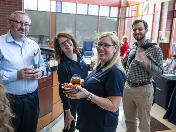 four people with refreshments