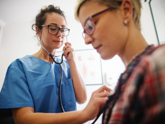 doctor listens to patient