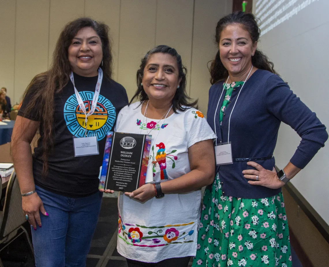 Alma Ramirez (center) receiving award.