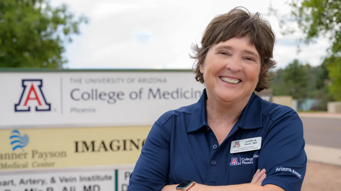 Judith Hunt, MD, shown standing in front of University College of Medicine Phoenix