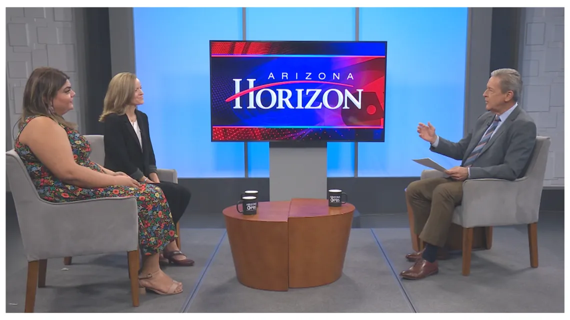 two women sit for a tv interview