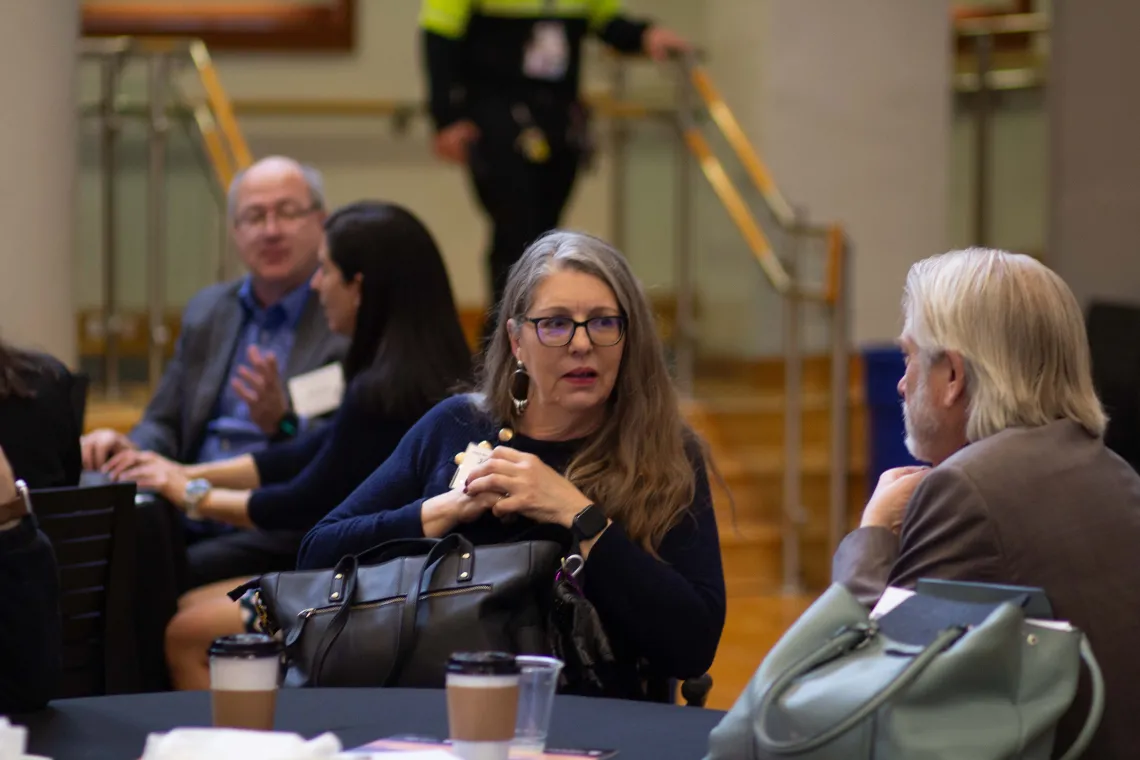 Representative Longdon listens to Dr. Derksen