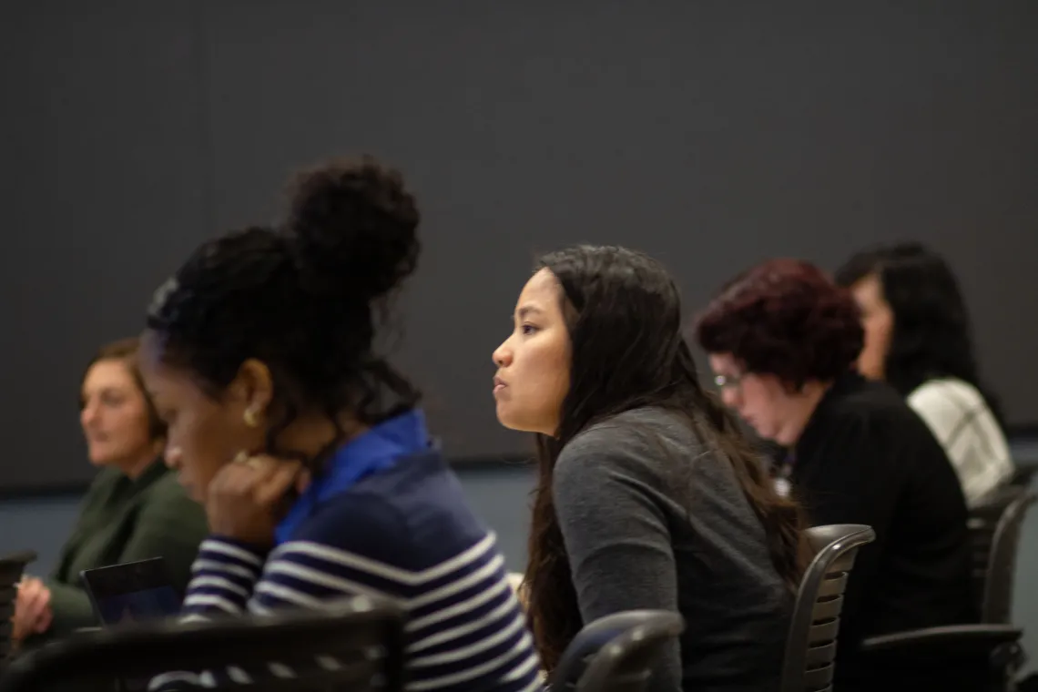 audience listens in a breakout session