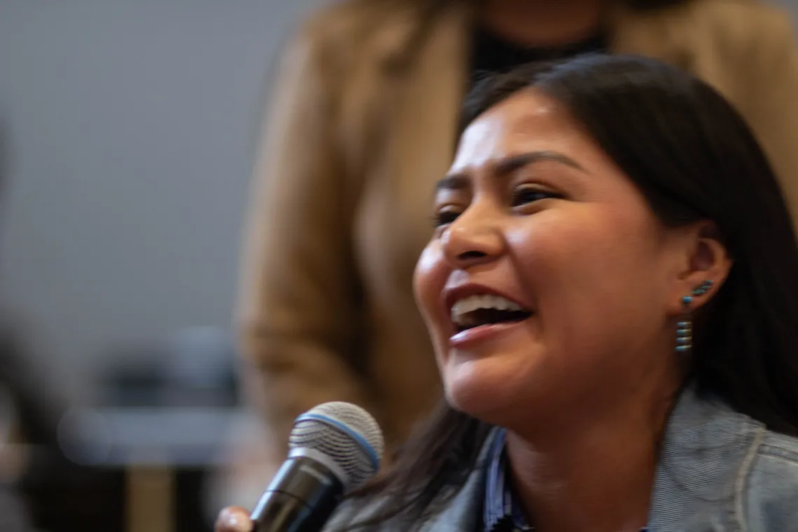 an attendee asks a question of a presenter