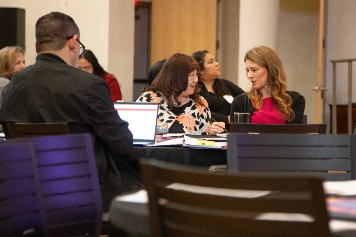 two attendees in discussion 