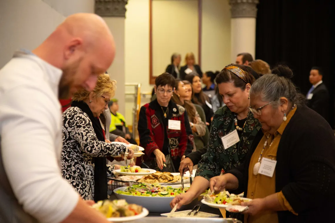 people gathered at the lunch buffet