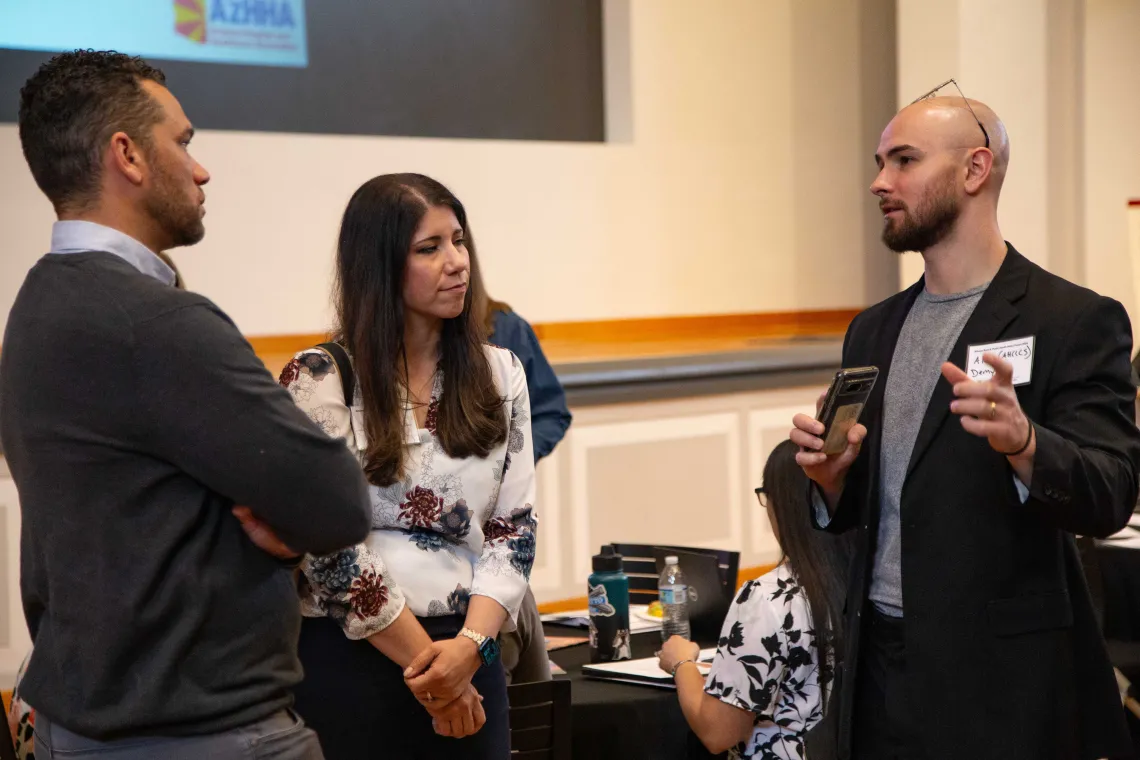 Marcus Johnson, Carmen Heredia listen to Alex Demyan