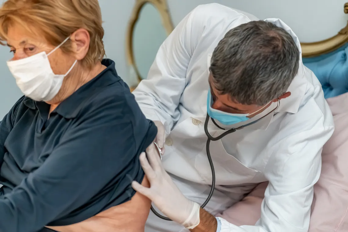 Doctor listening to patient