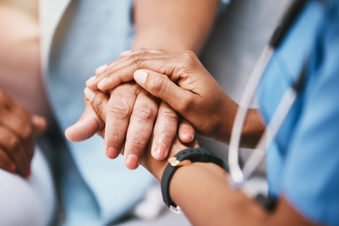 Dr. holding a patients hands