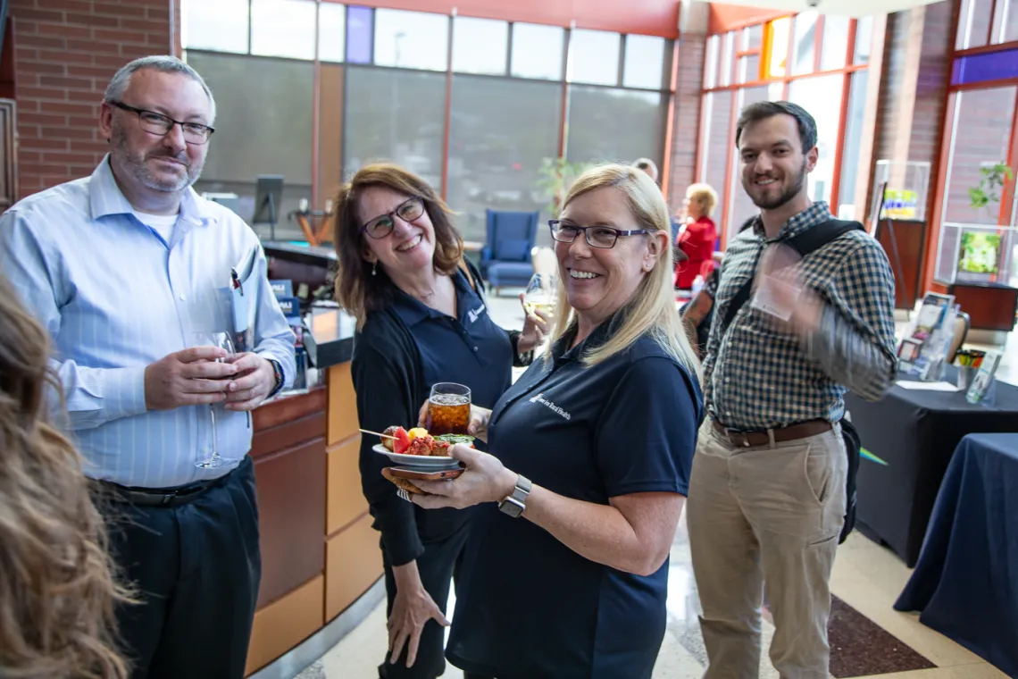 four people with refreshments