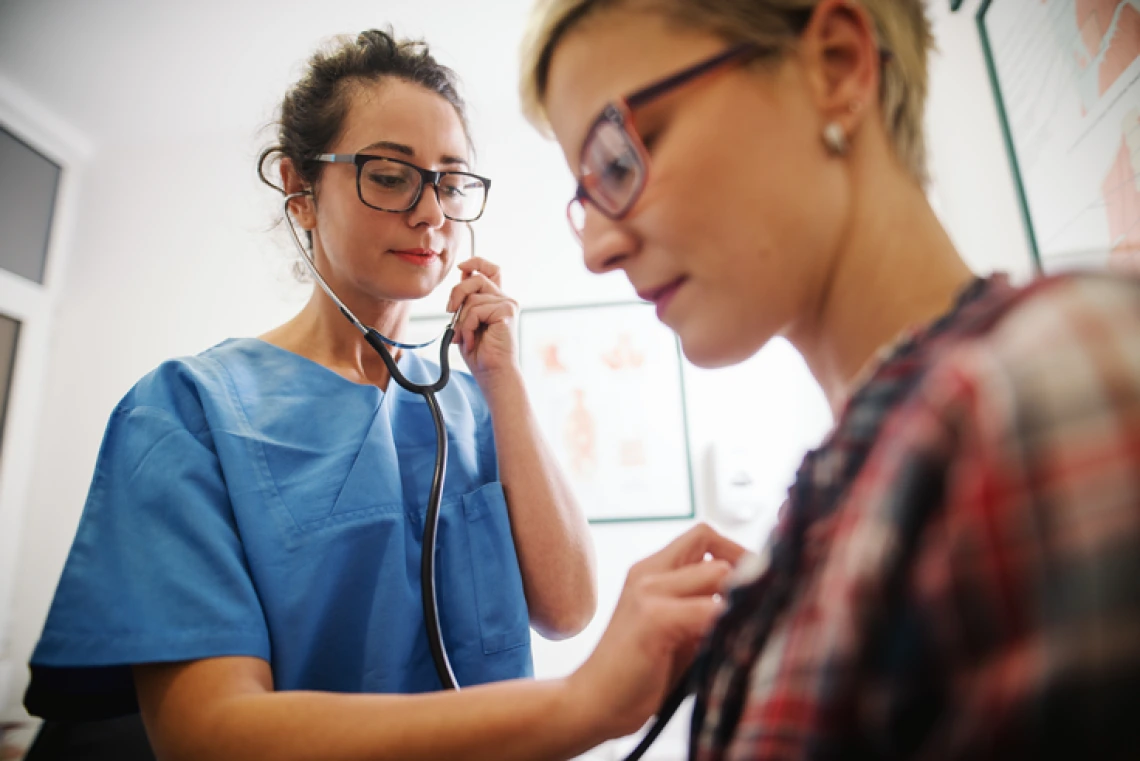 doctor listens to patient