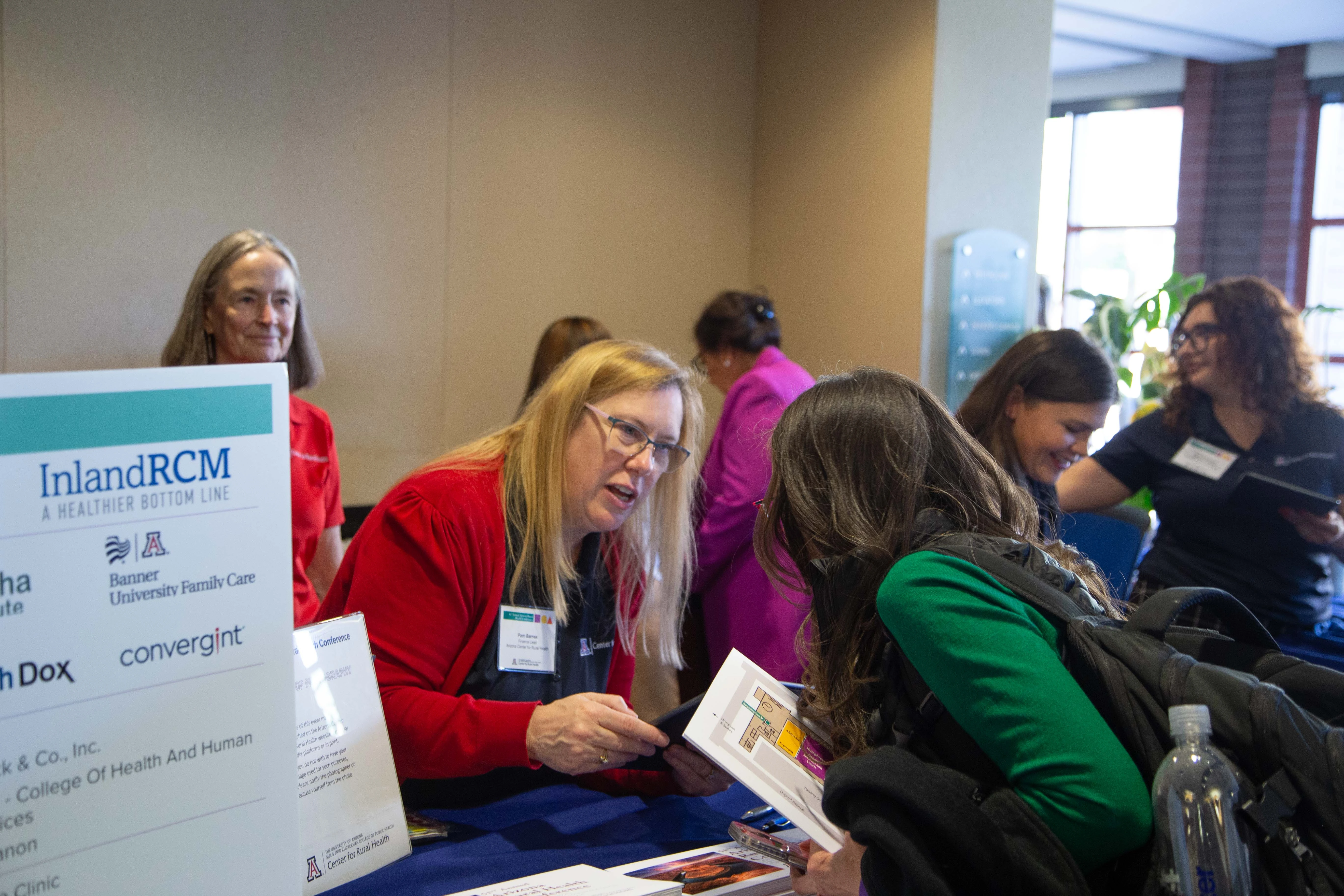 Pam Parnes checks in an attendee