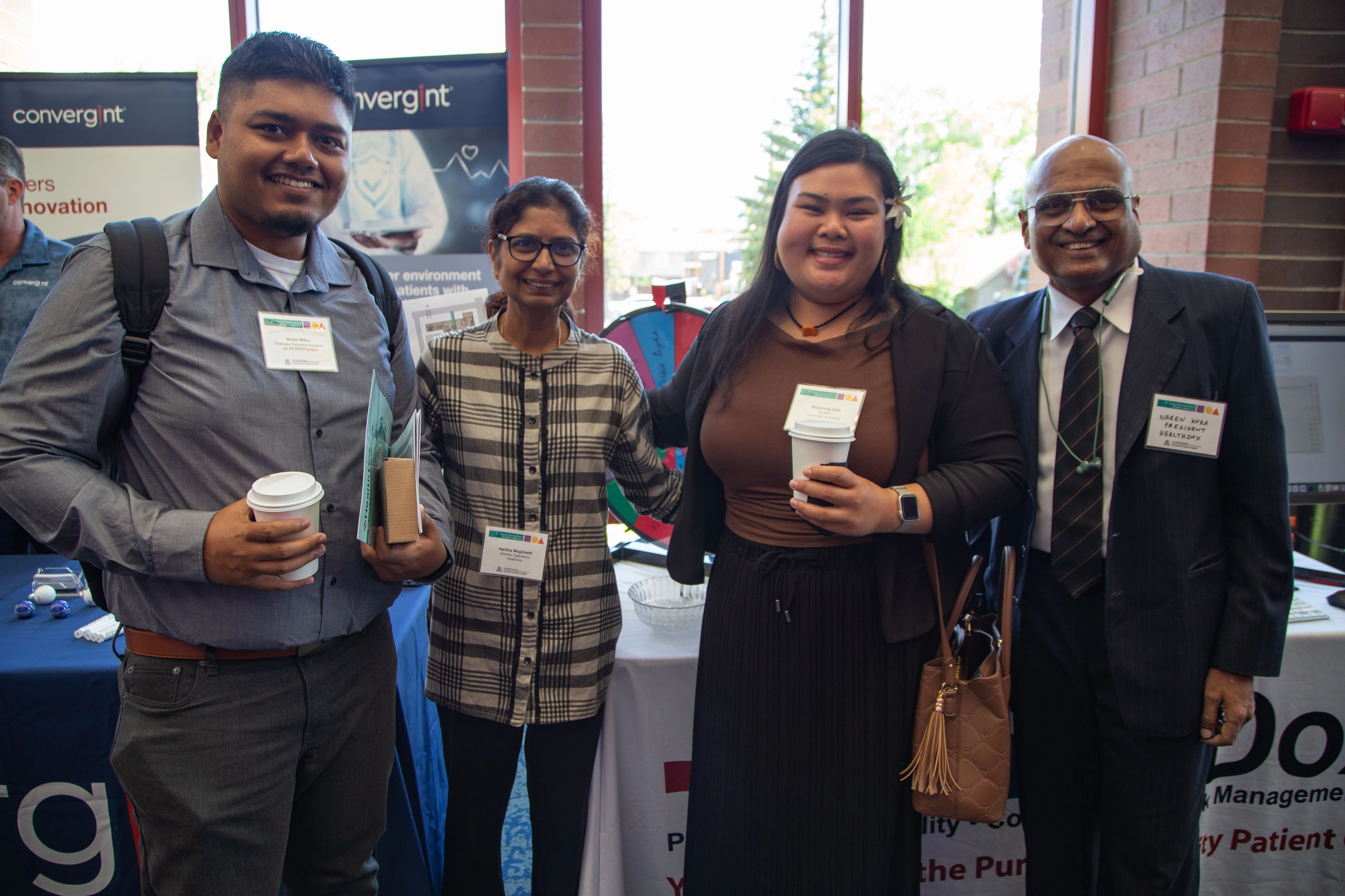 MEZCOPH students Imran Mithu and Shunrang Chin talk with vendors