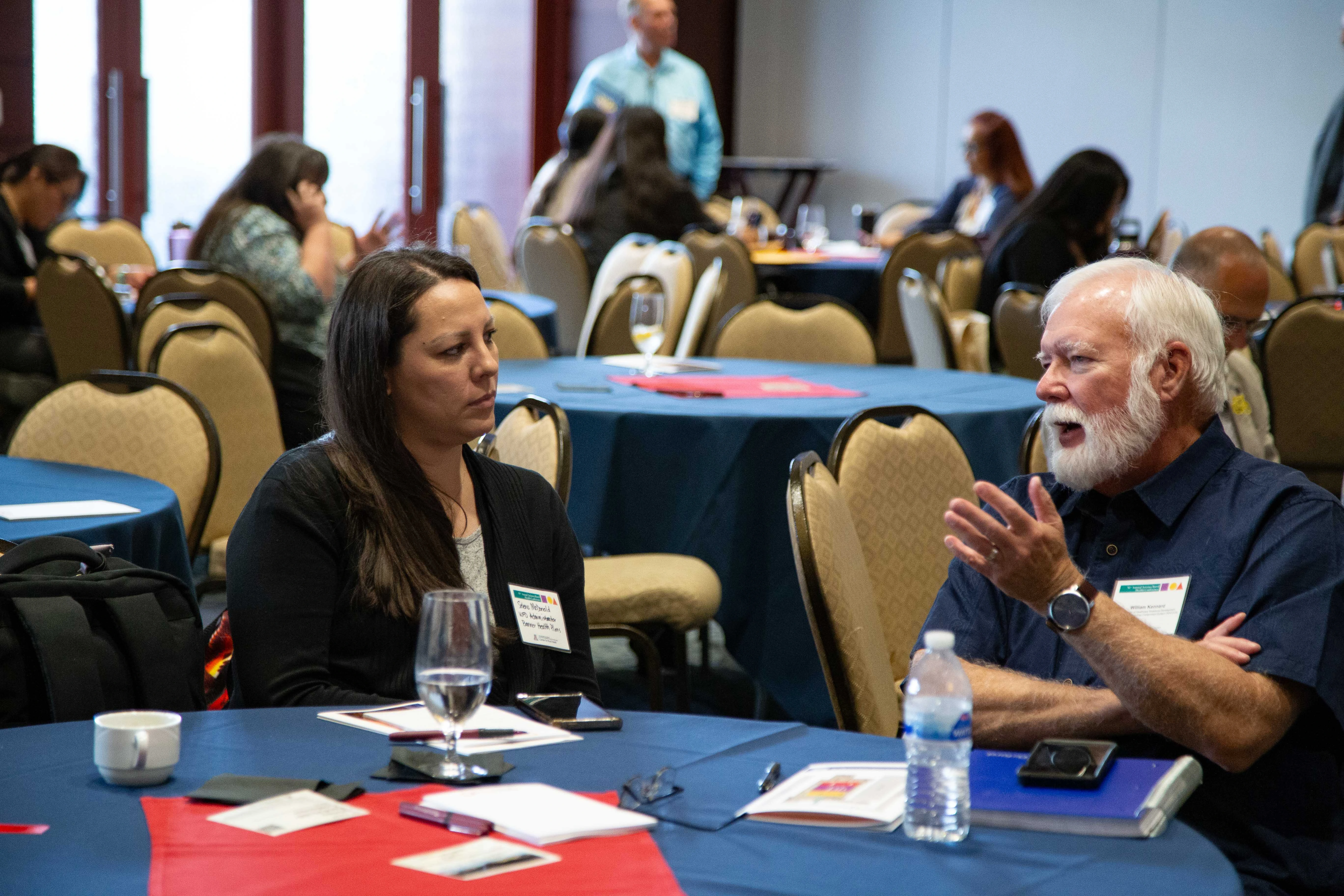 Bill Kennard talks with an attendee