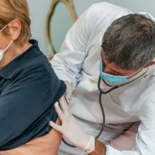 Doctor listening to patient