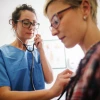doctor listens to patient