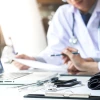 doctor with bills